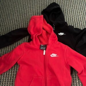 Two Nike sweatshirts , black and red size 4/5